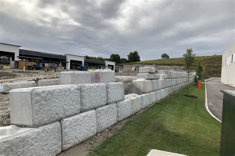 Our retaining wall blocks come is a variety of sizes and can accommodate wall designs up to 30’ +. Our Atlas Concrete Products team will assist clients in navigating through site challenges and offer product solutions. Partnering with our clients, engineers and architects to provide site visits and full wall designs is key to a good start and ...